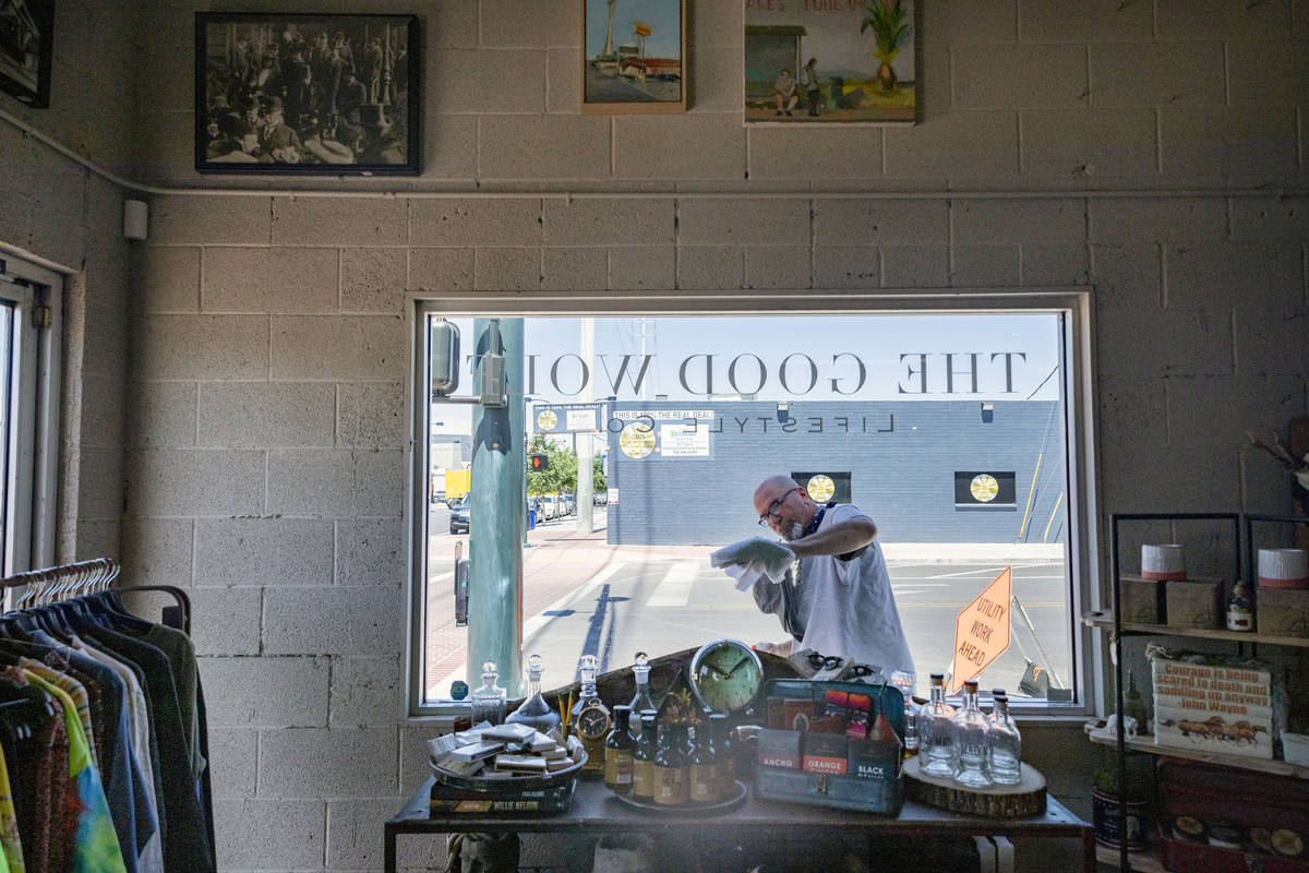 Erik Cerza, owner of I Love Windown cleaning company, cleans the windows at the Good Wolf Lifes ...